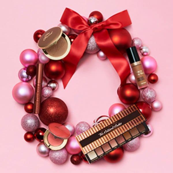 Too faced products in a christmas wreath